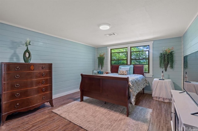 4915 Albert Pike Rd, Hot Springs, AR 71913 - bedroom with dark wood-style floors, wood walls, and baseboards