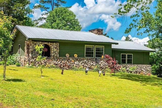 4915 Albert Pike Rd, Hot Springs, AR 71913 - view of front of house with stone siding, a front yard, a chimney, and metal roof