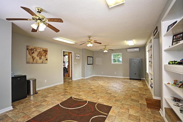900 Anderson Ave, White Hall, AR 71602 - unfurnished room with light stone finish flooring, a wall mounted air conditioner, ceiling fan, a textured ceiling, and built in shelves