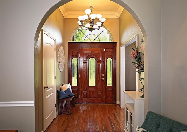 900 Anderson Ave, White Hall, AR 71602 - entrance foyer with a chandelier, arched walkways, crown molding, and dark wood finished floors