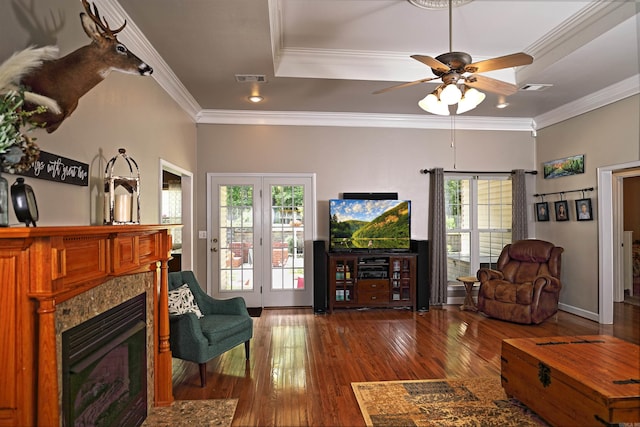 900 Anderson Ave, White Hall, AR 71602 - living area with wood-type flooring, crown molding, a tray ceiling, a ceiling fan, and a fireplace