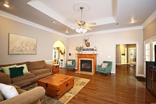 900 Anderson Ave, White Hall, AR 71602 - living area featuring arched walkways, ornamental molding, a raised ceiling, wood finished floors, and ceiling fan