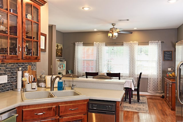 900 Anderson Ave, White Hall, AR 71602 - kitchen with a sink, a peninsula, a ceiling fan, light countertops, and wood finished floors