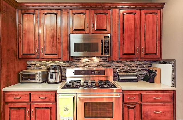 900 Anderson Ave, White Hall, AR 71602 - kitchen featuring stainless steel appliances, light countertops, and decorative backsplash