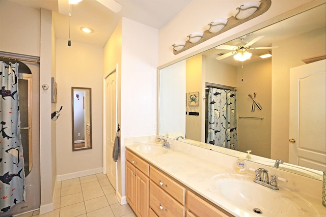900 Anderson Ave, White Hall, AR 71602 - full bath with a ceiling fan, tile patterned floors, baseboards, double vanity, and curtained shower