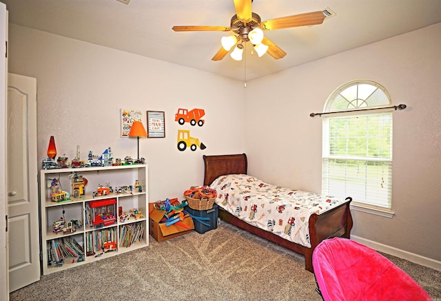 900 Anderson Ave, White Hall, AR 71602 - carpeted bedroom with baseboards and a ceiling fan