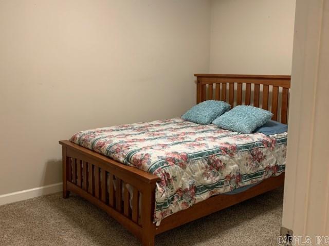 8 Tombstone Ct, Little Rock, AR 72209 - bedroom featuring carpet floors and baseboards