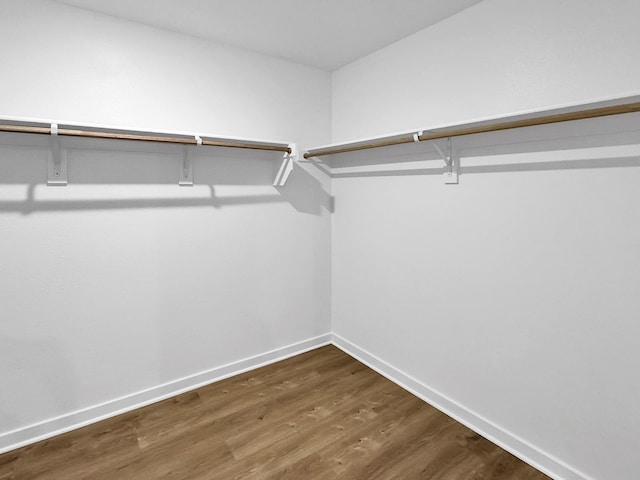 1513 Ridgefield Cir, Searcy, AR 72143 - walk in closet featuring dark wood finished floors