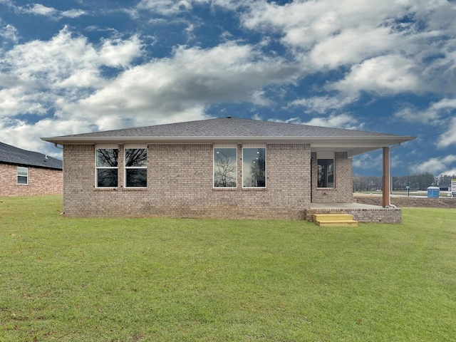 1513 Ridgefield Cir, Searcy, AR 72143 - back of property with brick siding, a lawn, and a shingled roof
