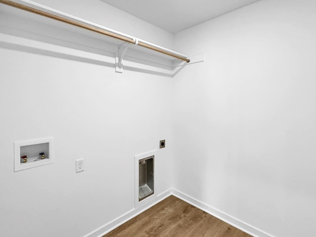 1513 Ridgefield Cir, Searcy, AR 72143 - washroom featuring hookup for an electric dryer, hookup for a washing machine, dark wood-style flooring, and baseboards