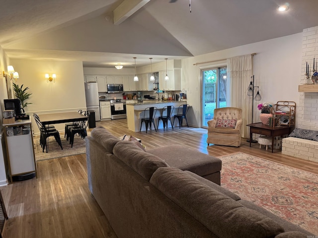 living room with wood finished floors and recessed lighting
