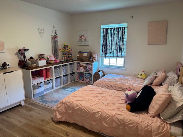 bedroom featuring wood finished floors
