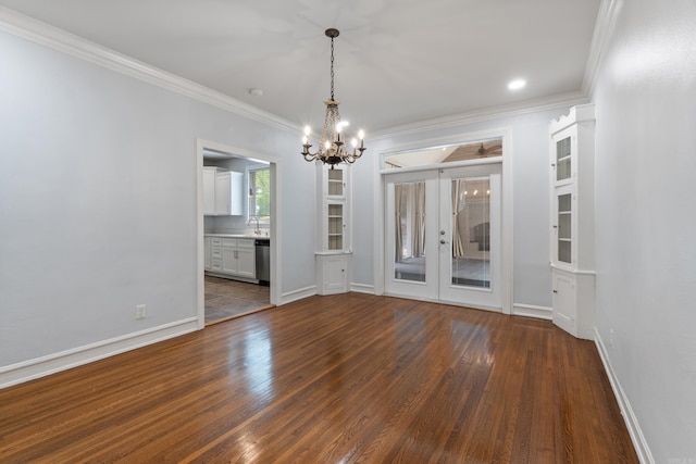 111 Midland St, Little Rock, AR 72205 - unfurnished dining area with french doors, crown molding, a chandelier, dark wood finished floors, and a sink