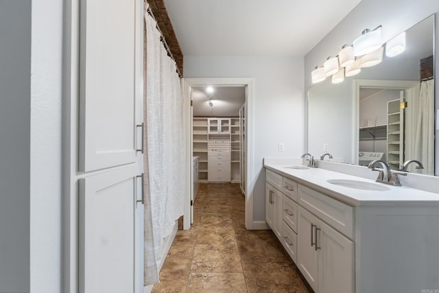 111 Midland St, Little Rock, AR 72205 - bathroom featuring a spacious closet and double vanity