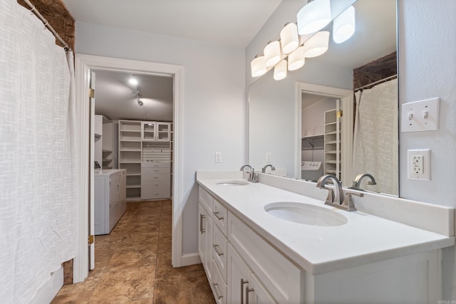 111 Midland St, Little Rock, AR 72205 - bathroom with independent washer and dryer, a spacious closet, and double vanity