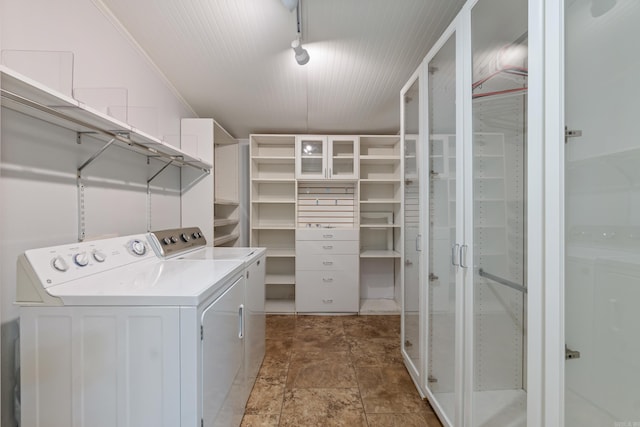 111 Midland St, Little Rock, AR 72205 - laundry room with washing machine and dryer and stone finish floors