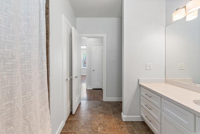 111 Midland St, Little Rock, AR 72205 - bathroom with vanity, baseboards, and curtained shower