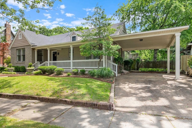 111 Midland St, Little Rock, AR 72205 - view of front of house with concrete driveway, brick siding, a porch, roof with shingles, and a carport