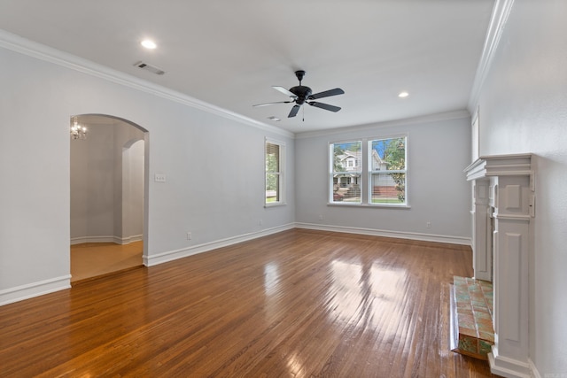 111 Midland St, Little Rock, AR 72205 - unfurnished living room featuring arched walkways, wood finished floors, ceiling fan, crown molding, and baseboards