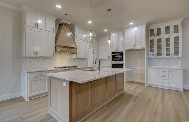 173 Maumelle Valley Dr, Maumelle, AR 72113 - kitchen featuring a sink, appliances with stainless steel finishes, light wood-type flooring, white cabinets, and recessed lighting