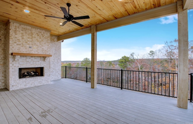 173 Maumelle Valley Dr, Maumelle, AR 72113 - wooden deck with an outdoor brick fireplace and ceiling fan