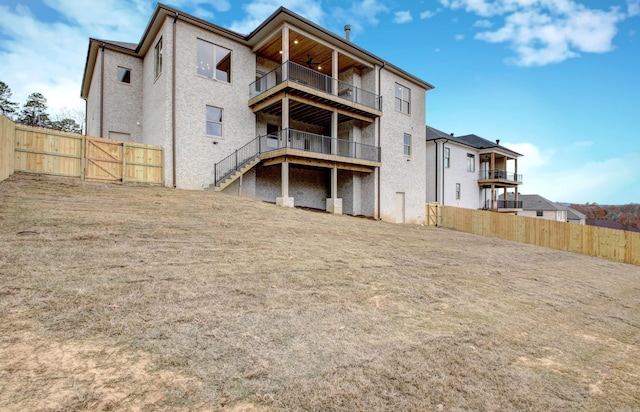 173 Maumelle Valley Dr, Maumelle, AR 72113 - rear view of property with a balcony, a fenced backyard, a gate, and stairs