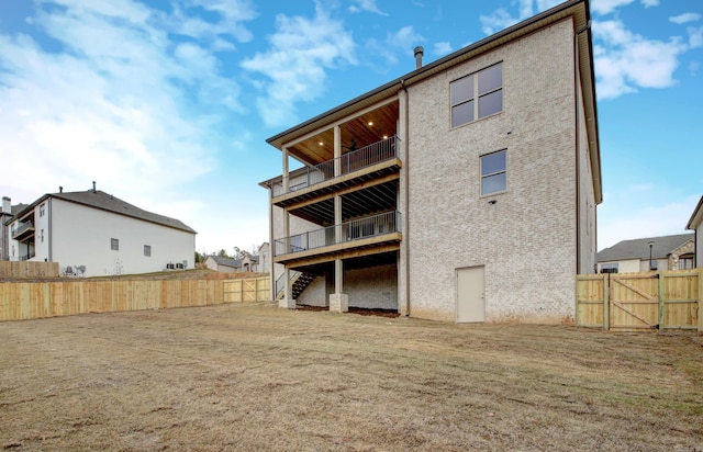 173 Maumelle Valley Dr, Maumelle, AR 72113 - rear view of house with a fenced backyard, stairs, and a gate