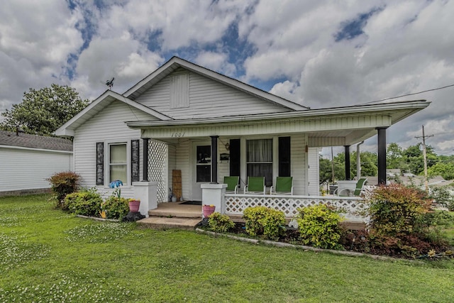 1001 W Mueller, Paragould, AR 72450 - view of front facade with covered porch and a front yard