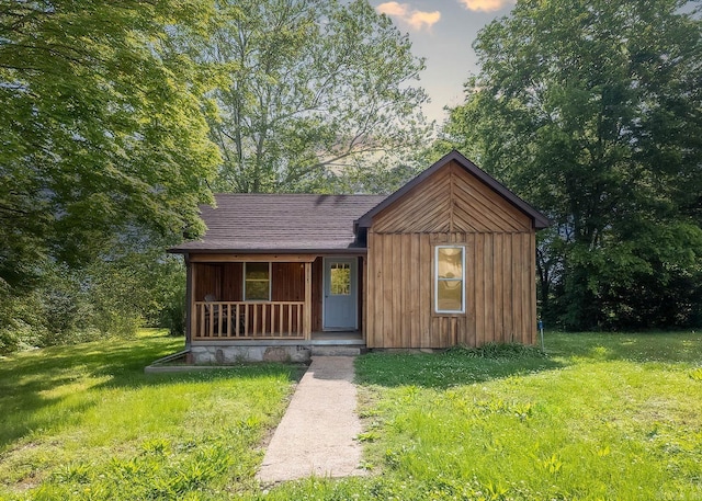618 N 9th St, Thayer, MO 65791 - rustic home with a porch, a front yard, and a shingled roof