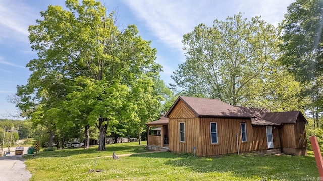 618 N 9th St, Thayer, MO 65791 - view of side of property with entry steps, a lawn, and roof with shingles