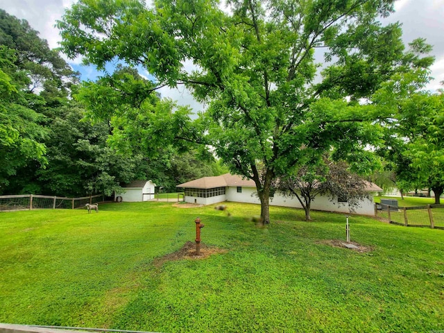 800 Hilltop Dr, Piggott, AR 72454 - view of yard with an outbuilding and a storage shed