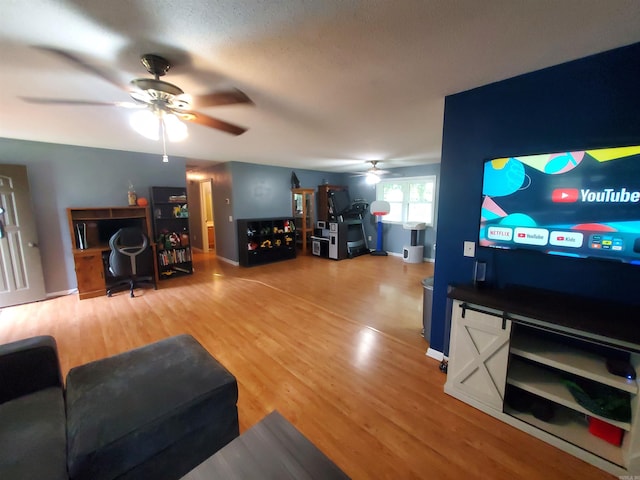 800 Hilltop Dr, Piggott, AR 72454 - living room with ceiling fan, light wood-style flooring, and baseboards