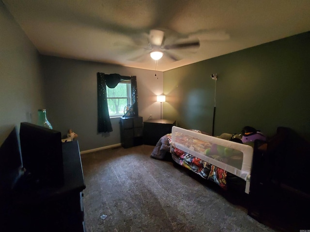 800 Hilltop Dr, Piggott, AR 72454 - carpeted bedroom with baseboards and a ceiling fan