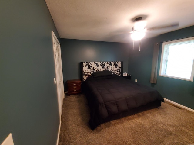 800 Hilltop Dr, Piggott, AR 72454 - carpeted bedroom featuring baseboards and a ceiling fan