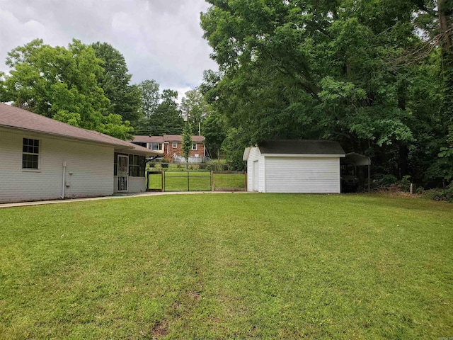 800 Hilltop Dr, Piggott, AR 72454 - view of yard featuring a storage unit and an outbuilding