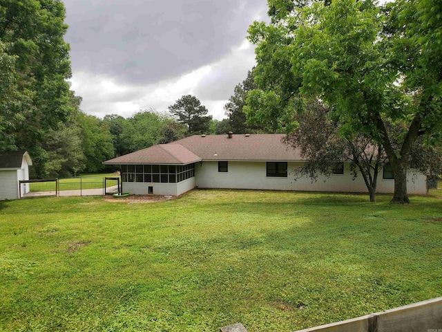 800 Hilltop Dr, Piggott, AR 72454 - back of property with a sunroom and an outdoor structure