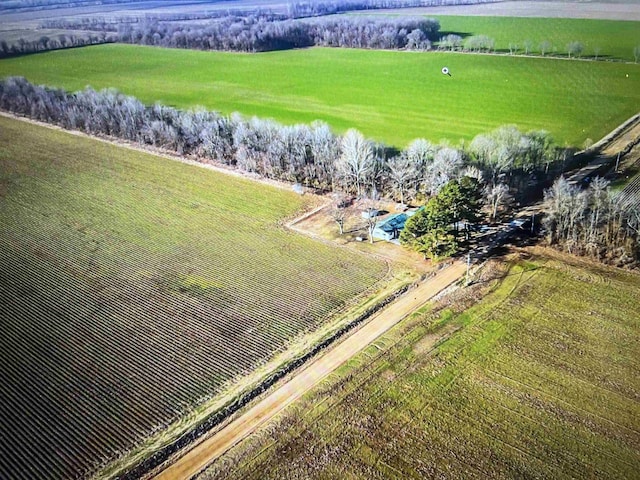 aerial view of sparsely populated area featuring farmland
