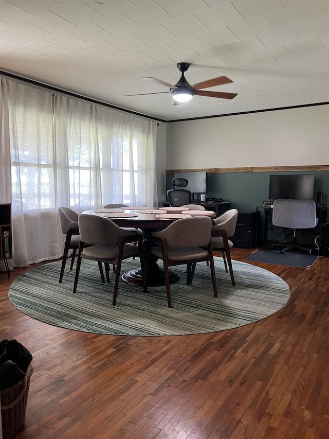 dining area featuring ceiling fan, an office area, and wood finished floors