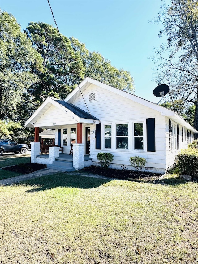 view of front of property with a front yard and crawl space