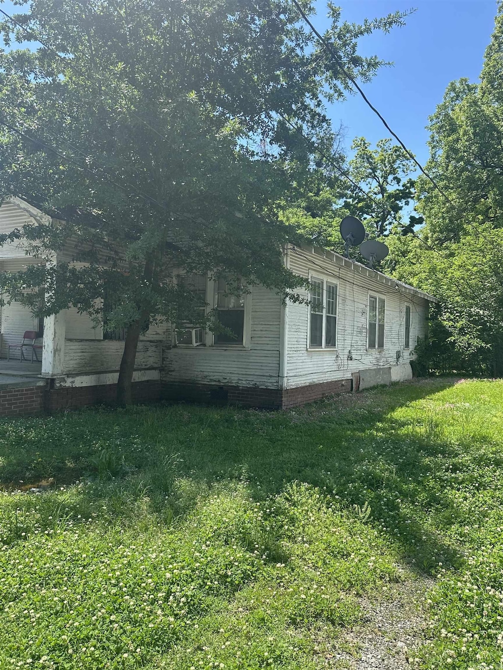 view of home's exterior featuring a yard