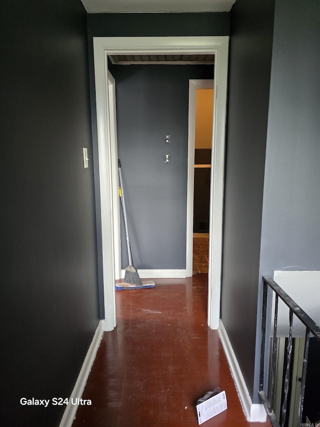 hallway featuring baseboards
