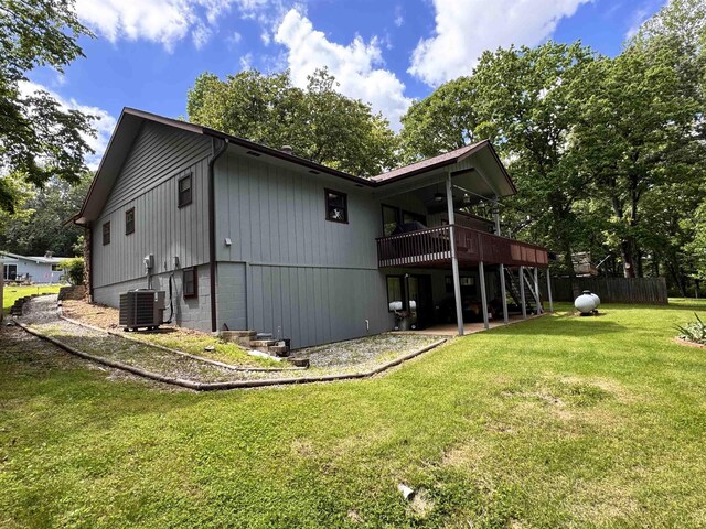 7 Minentonka Dr, Cherokee Village, AR 72529 - back of property featuring a wooden deck, a lawn, cooling unit, and a patio