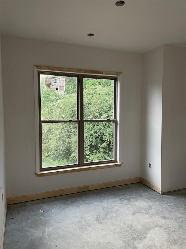 25 Mountain Grove Rd, Greenbrier, AR 72058 - unfurnished room featuring concrete floors, plenty of natural light, and baseboards