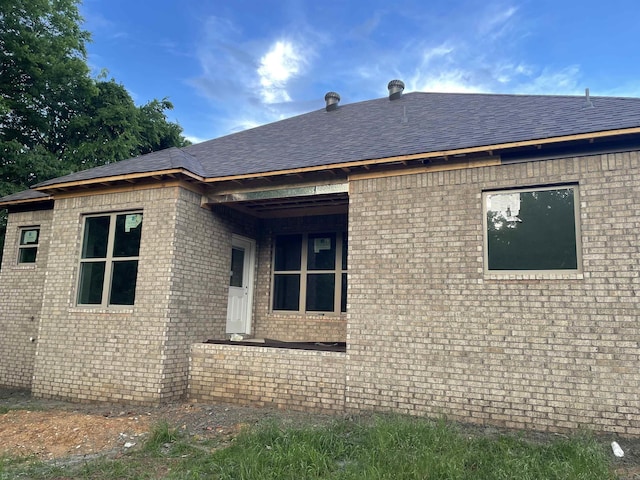 25 Mountain Grove Rd, Greenbrier, AR 72058 - view of side of property with brick siding and roof with shingles