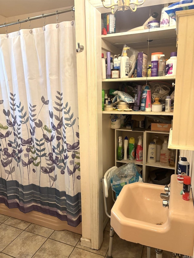 1222 Hendrix Ave, Little Rock, AR 72204 - full bath featuring a sink, tile patterned flooring, and a shower with shower curtain