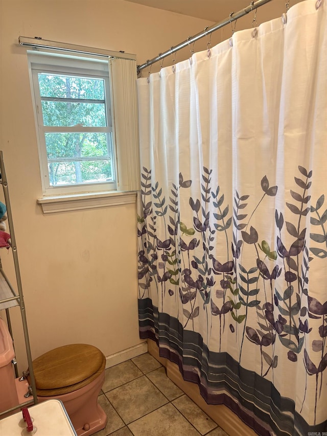 1222 Hendrix Ave, Little Rock, AR 72204 - full bathroom featuring tile patterned floors, toilet, a shower with curtain, and baseboards