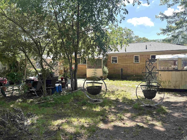 1222 Hendrix Ave, Little Rock, AR 72204 - view of yard with fence and a sunroom