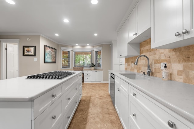 8 Cannon Ct, Little Rock, AR 72212 - kitchen featuring a sink, crown molding, recessed lighting, light countertops, and appliances with stainless steel finishes