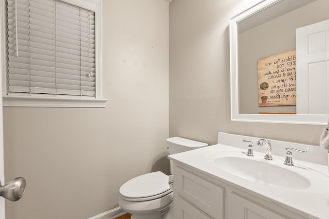 8 Cannon Ct, Little Rock, AR 72212 - bathroom with toilet, vanity, and baseboards