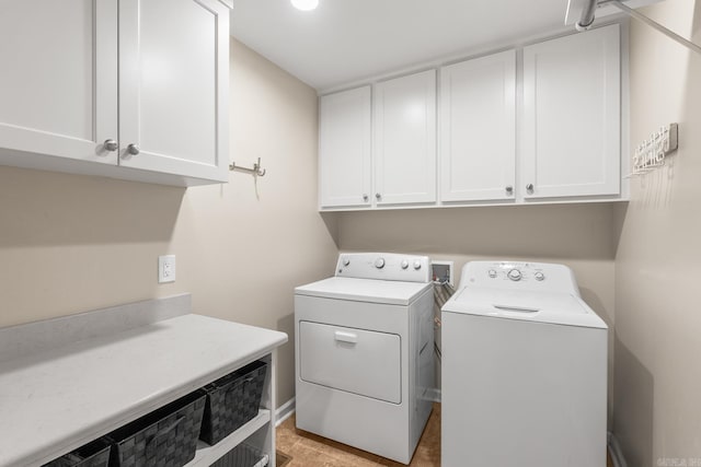 8 Cannon Ct, Little Rock, AR 72212 - clothes washing area featuring cabinet space and washing machine and clothes dryer